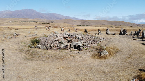 Aerial view of megalithic standing stones and burial mound of Zorats Karer or Carahunge - prehistoric monument in Armenia. Armenian Stonehenge stock photography