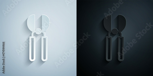 Paper cut Gardening handmade scissors for trimming icon isolated on grey and black background. Pruning shears with wooden handles. Paper art style. Vector