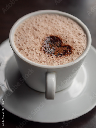 Coffee latte heart art in white coffee cup