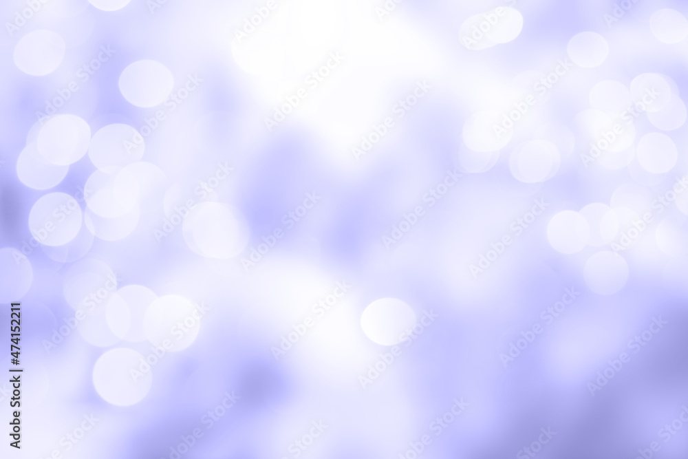 Bokeh background. Bright blurry textures of lights on a violet backdrop. Very peri, color of the year 2022.