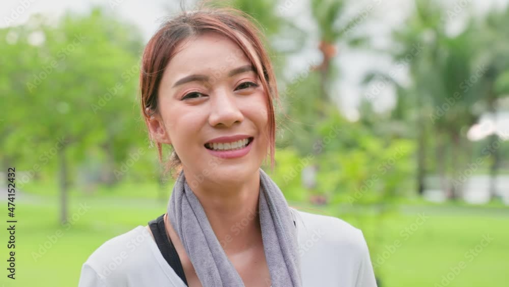 Asian active sport woman stand with confidence after exercise outdoors. Asian active sport woman stand with confidence after exercise outdoors.