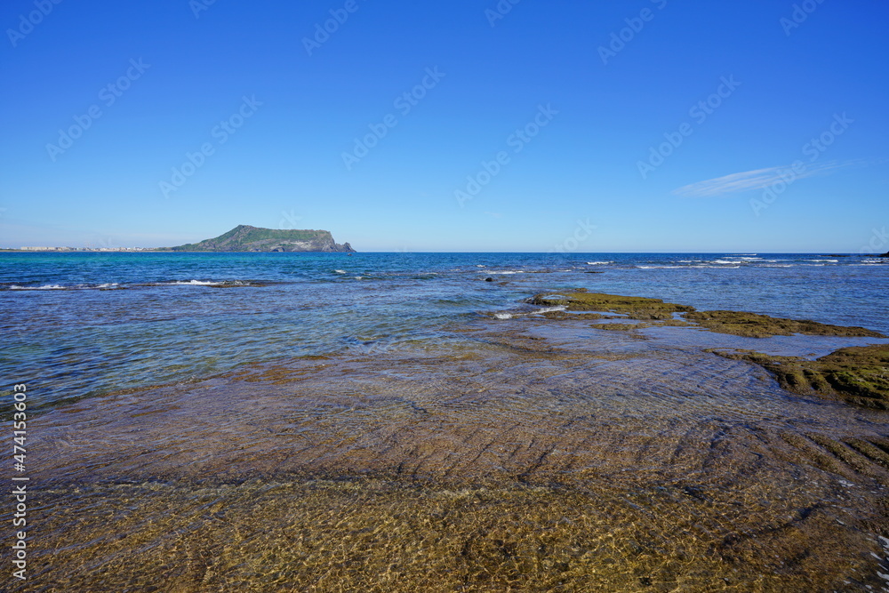 a shoaling beach with clear water