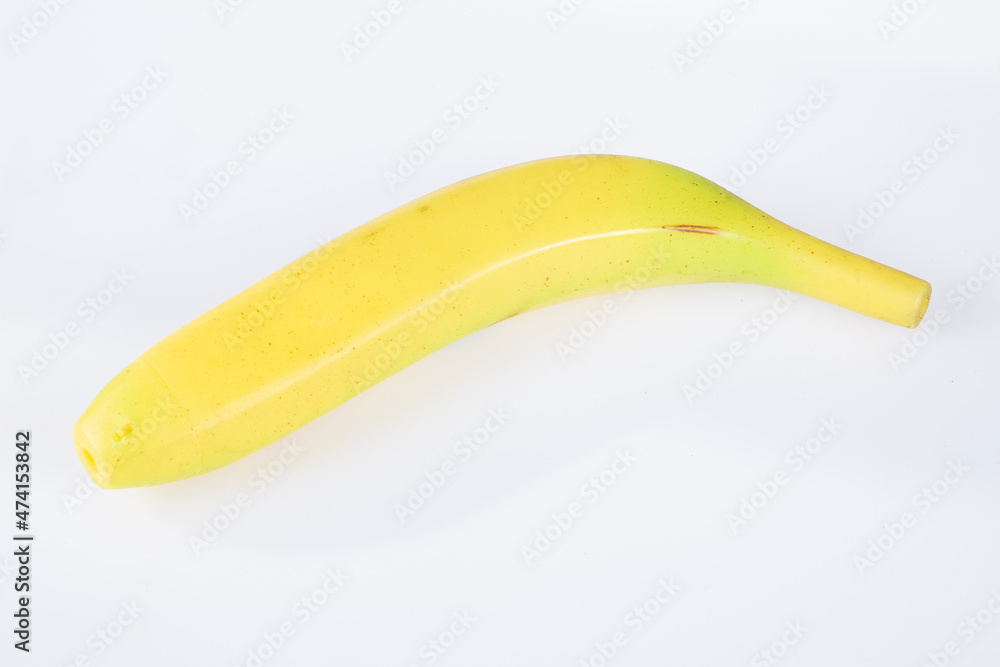 artificial banana plastic yellow box toy on white background