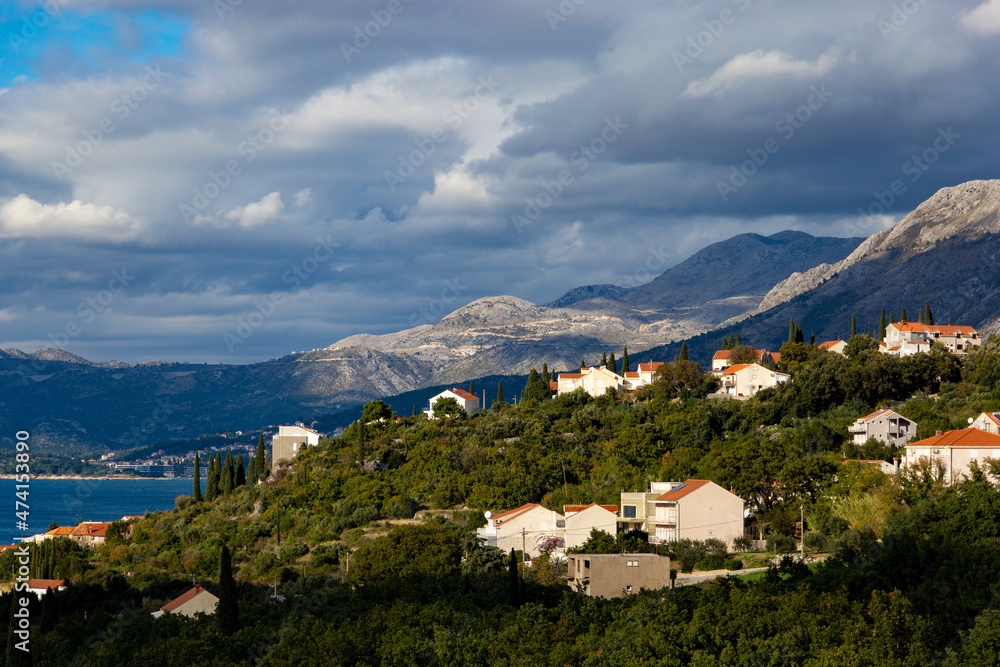 Mountains on the Adriatic coast. Settlements on the shore.