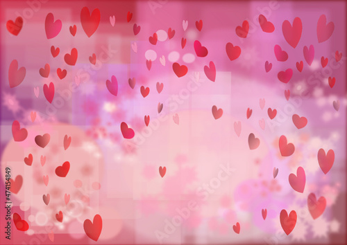 Pink Valentine's background. Bokeh like background in pink with pink and red hearts for Valentine's Day
