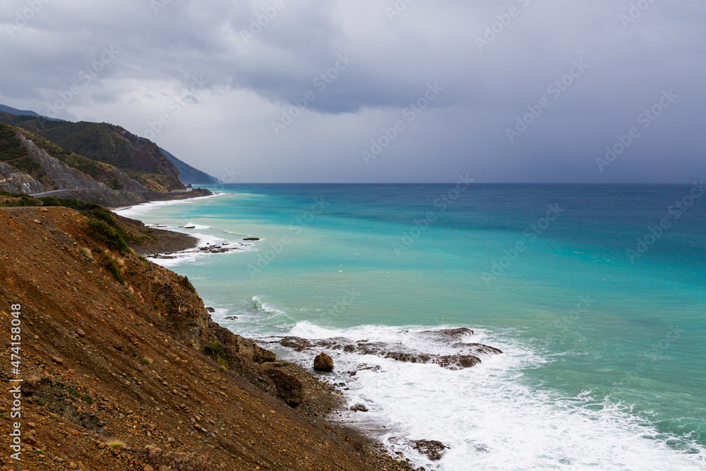 The coast of Samandag, where the Amanos mountains meet the Mediterranean Sea. The shores of Turkey's Hatay city, Samandag district. The impressive colors of the Mediterranean from green to blue. The coast of Samandag, where the Amanos mountains meet the Mediterranean Sea. The shores of Turkey's Hatay city, Samandag district. The impressive colors of the Mediterranean from green to blue.