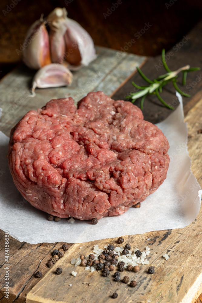 Fototapeta premium raw minced meat on dark wood