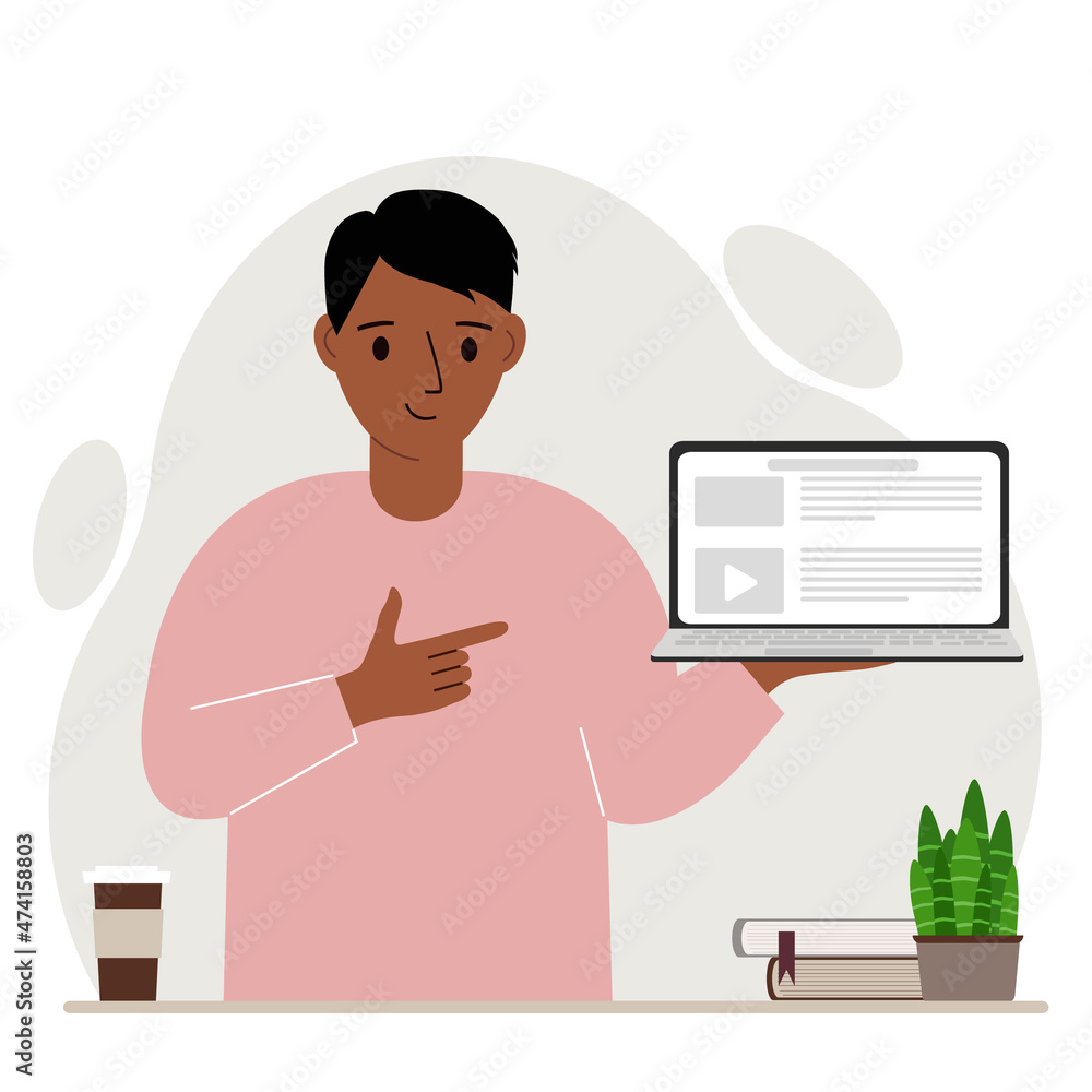 Happy man holding a laptop computer with one hand and pointing at it with the other. Laptop computer technology concept.