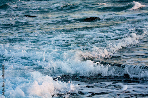 Sea foamy waves on the beach