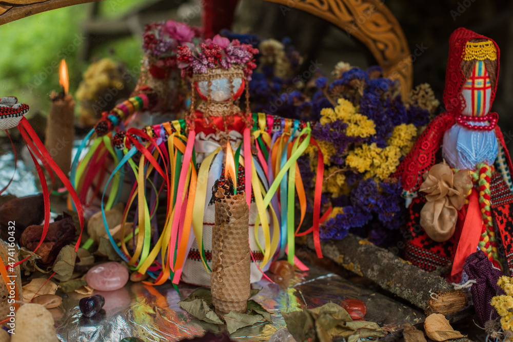 Obraz premium Altar of wicca, candle, magic books, tarot cards and other witch stuff. Mystic background with ritual esoteric objects, occult, fortune telling and Halloween concept