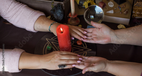 Altar of wicca, candle, magic books, tarot cards and other witch stuff. Mystic background with ritual esoteric objects, occult, fortune telling and Halloween concept