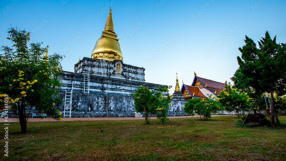 Background of important religious attractions in Thailand that are open for public viewing and making merit (Wat Phra Borommathat Thung Yang) Uttaradit) has an old chedi and a beautiful church. Background of important religious attractions in Thailand that are open for public viewing and making merit (Wat Phra Borommathat Thung Yang) Uttaradit) has an old chedi and a beautiful church.