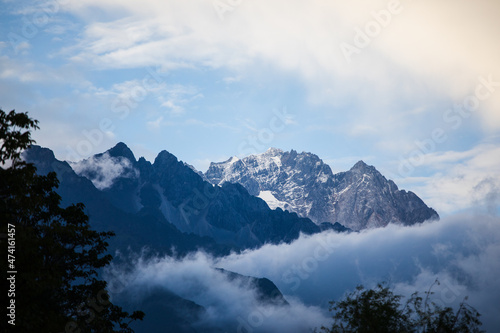 Jade Dragon Snow Mountain with clouds and blue sky near Lijiang in Yunnan province © okonato