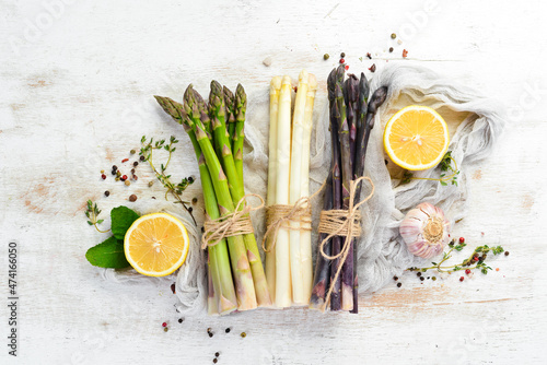 Asparagus. Raw organic asparagus brunch. Top view. Free space for your text.