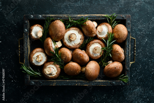 Mushrooms. royal champignon mushrooms in a wooden box. Rustic style. Top view.