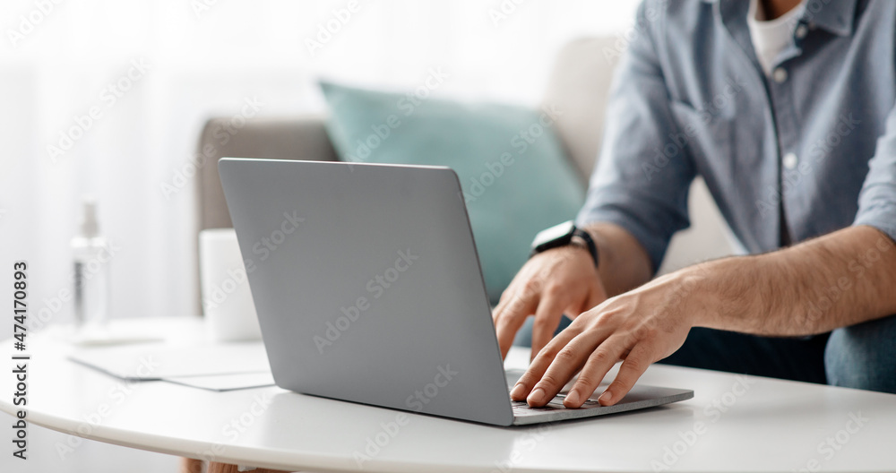 Working at laptop pc. Male hands on pc keyboard, typing text or programming code in computer Working at laptop pc. Male hands on pc keyboard, typing text or programming code in computer