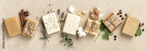 Natural soap bars and ingredients on beige background, flat lay