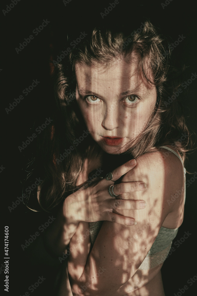 Artistic portrait of a young woman with retro shadow play style