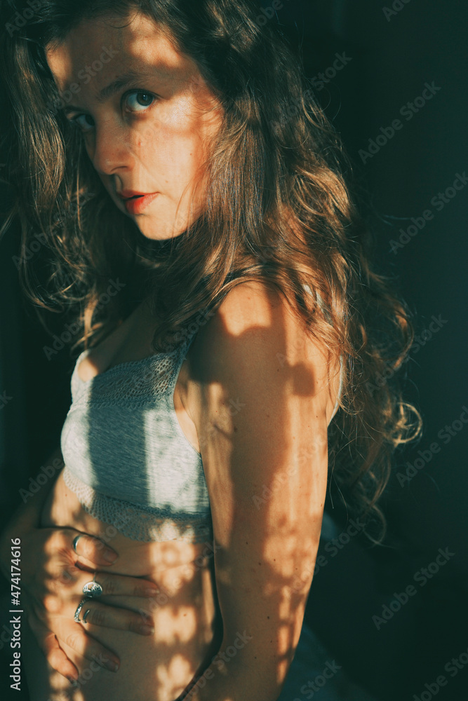 Artistic portrait of a young woman with retro shadow play style