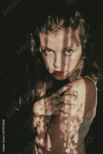 Obraz na płótnie Artistic portrait of a young woman with retro shadow play style w salonie