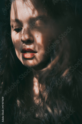 Artistic portrait of a young woman with retro shadow play style