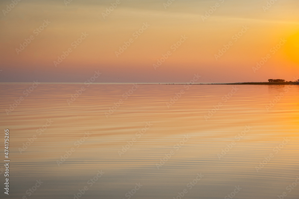 Beautiful sunset over Baltic sea. Natural background. Estonia. Afterglow, evening calm on the Sea.