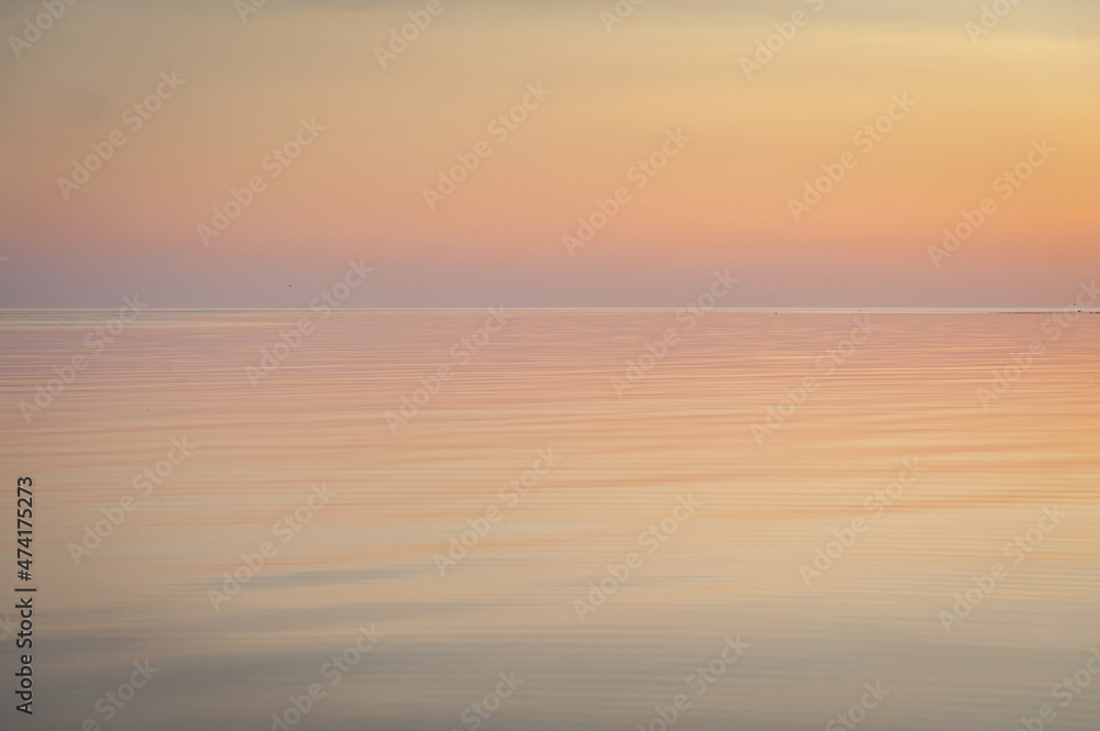 Fototapeta premium Beautiful sunset over Baltic sea. Natural background. Estonia. Afterglow, evening calm on the Sea.