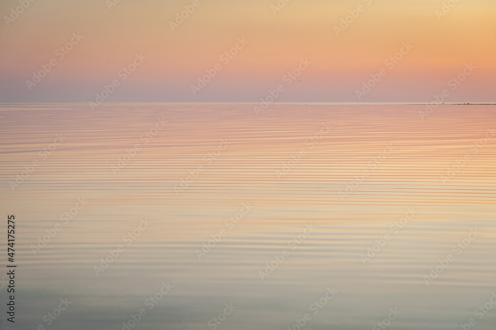 Beautiful sunset over Baltic sea. Natural background. Estonia. Afterglow, evening calm on the Sea.