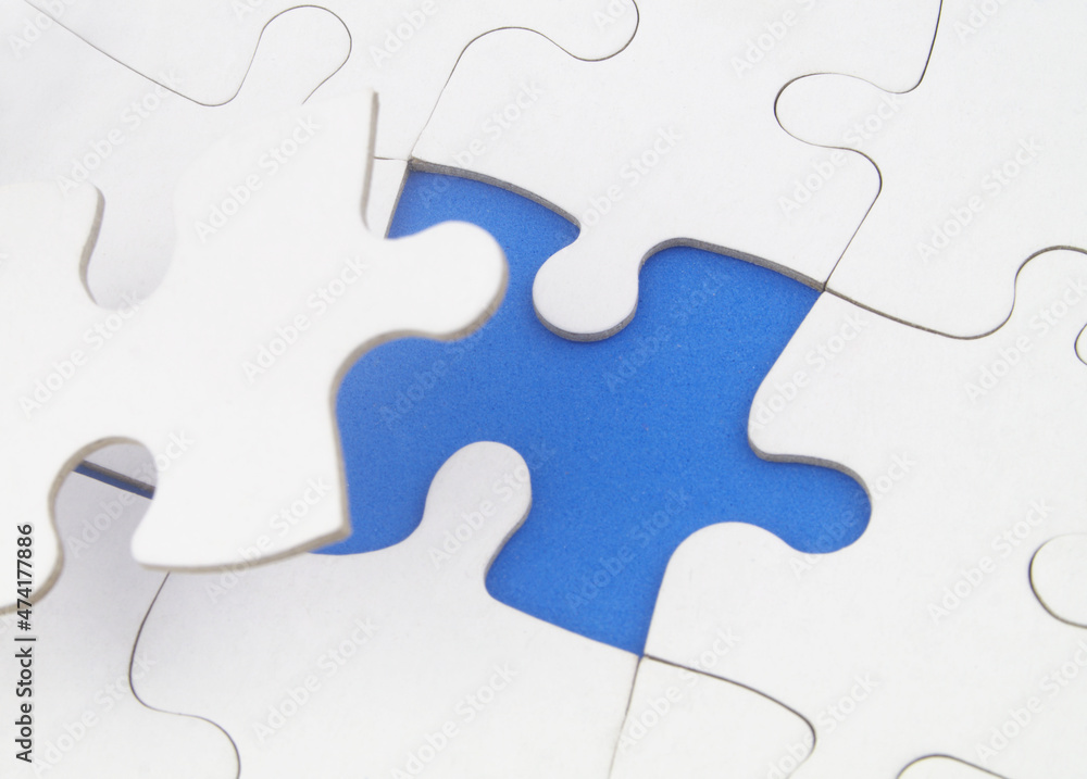 White jigsaw puzzles background, one piece missing and ready to connecting. Business strategy, teamwork, problem solving and complete mission concept. White jigsaw puzzles background, one piece missing and ready to connecting. Business strategy, teamwork, problem solving and complete mission concept.