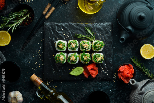 Sushi rolls - Kyoto with salmon, cucumber and Chuka salad. Sushi menu bar. Japanese food