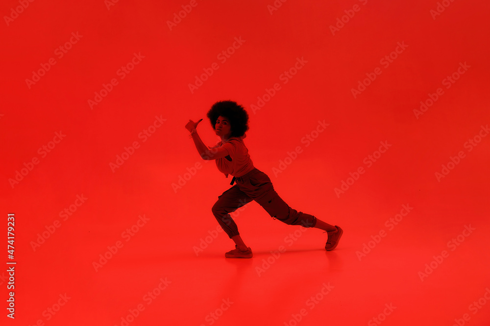Young black woman dancing hip hop dance