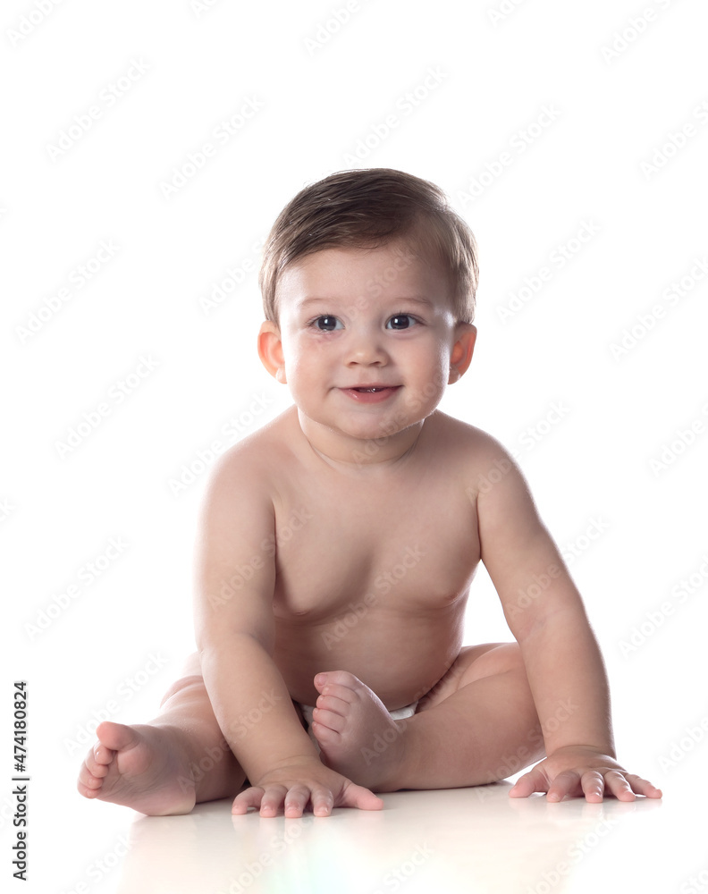 Cute baby in diaper looking at the camera Cute baby in diaper looking at the camera