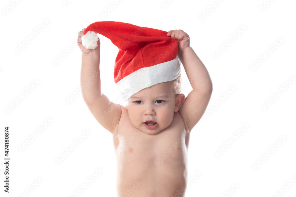 Happy baby wearing a Christmas hat Happy baby wearing a Christmas hat