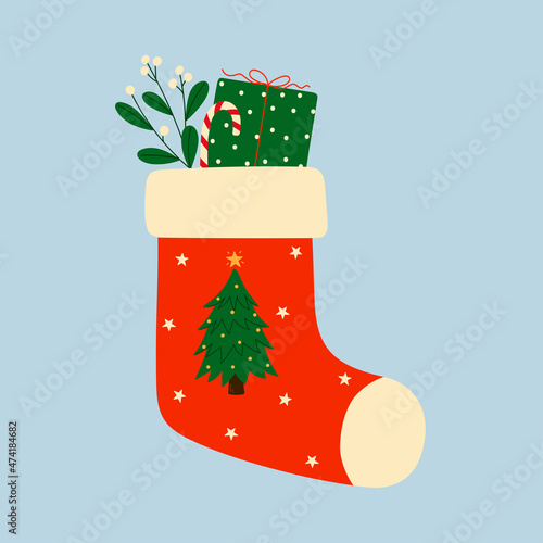 Red christmas sock with gift box, mistletoe branch and candy cane. Christmas winter design element in doodle style. 