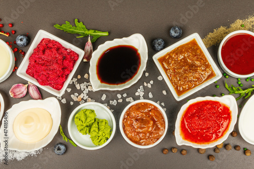 Fototapeta Naklejka Na Ścianę i Meble -  Set of different sauces - ketchup, mayonnaise, barbecue, soy, chutney, wasabi, adjika, horseradish