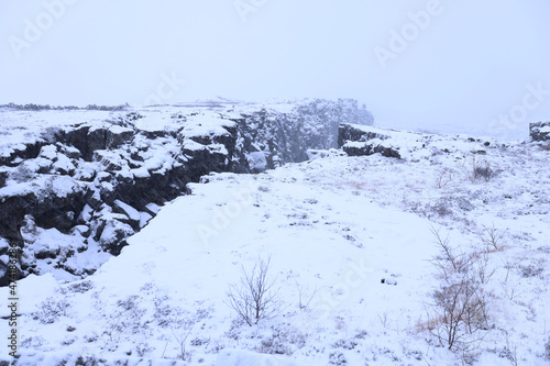 The conjunction of the Eurasian and American plates at Pingvellir in winter, Iceland