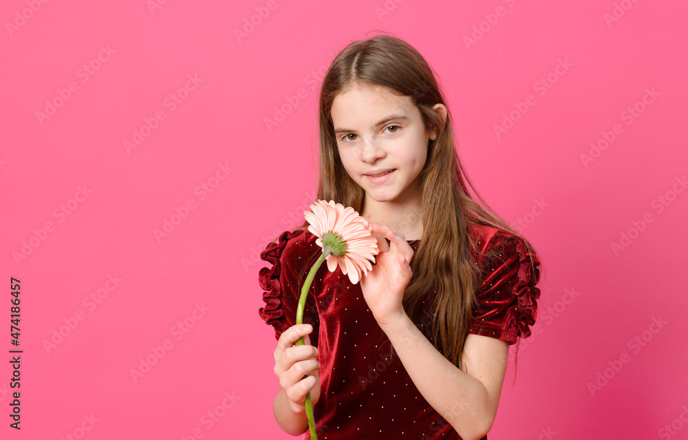 1 white teen girl with long hair in a red dress with a flower smiling on a pink 1 white teen girl with long hair in a red dress with a flower smiling on a pink