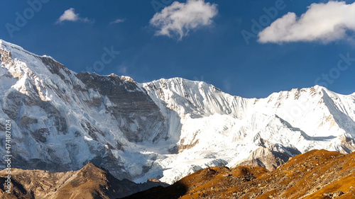 Mountain everest snow white cold freeze top of the world blue skies cloud shadow beautiful amazing view brown rock drone aerial chomolungma nepal tibet 