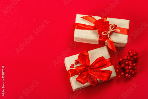 Gift concept in red colors. New Year or Christmas, festive mood