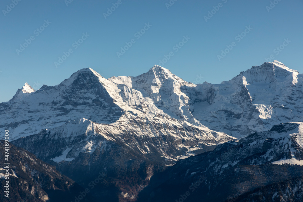 view from mountain Niederhorn to mountain peaks Eiger, Moench and Jungfrau in the bernese alps, Switzerland view from mountain Niederhorn to mountain peaks Eiger, Moench and Jungfrau in the bernese alps, Switzerland