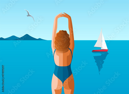 Girl standing with raised up hands on the beach