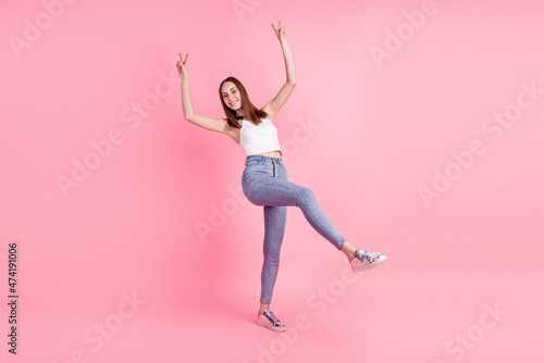 Full body photo of young cheerful girl show peace cool v-symbol wear modern clothes isolated over pink color background