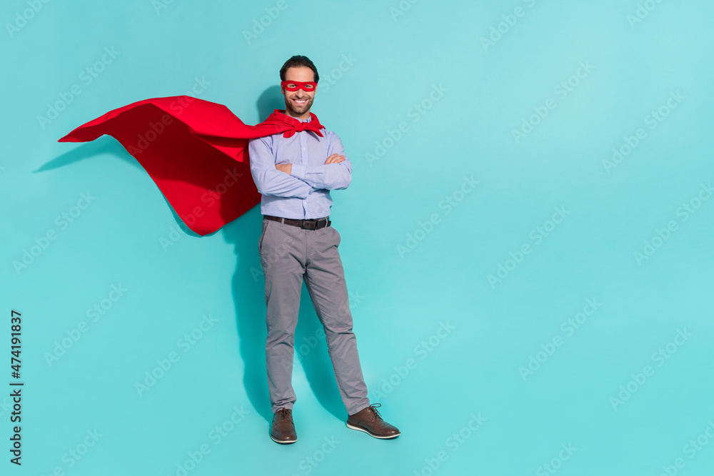 Photo of self-assured guy clerk folded arms beaming smile wear cape mask purple shirt isolated teal color background Photo of self-assured guy clerk folded arms beaming smile wear cape mask purple shirt isolated teal color background