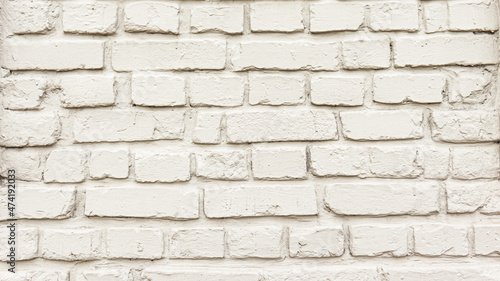White brick wall texture background. Rough uneven surface. a brick wall of a milky shade. 