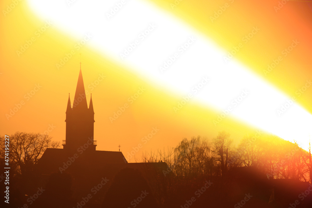 Obraz premium Sunset over church silhouette, shot with a special long exposure technique