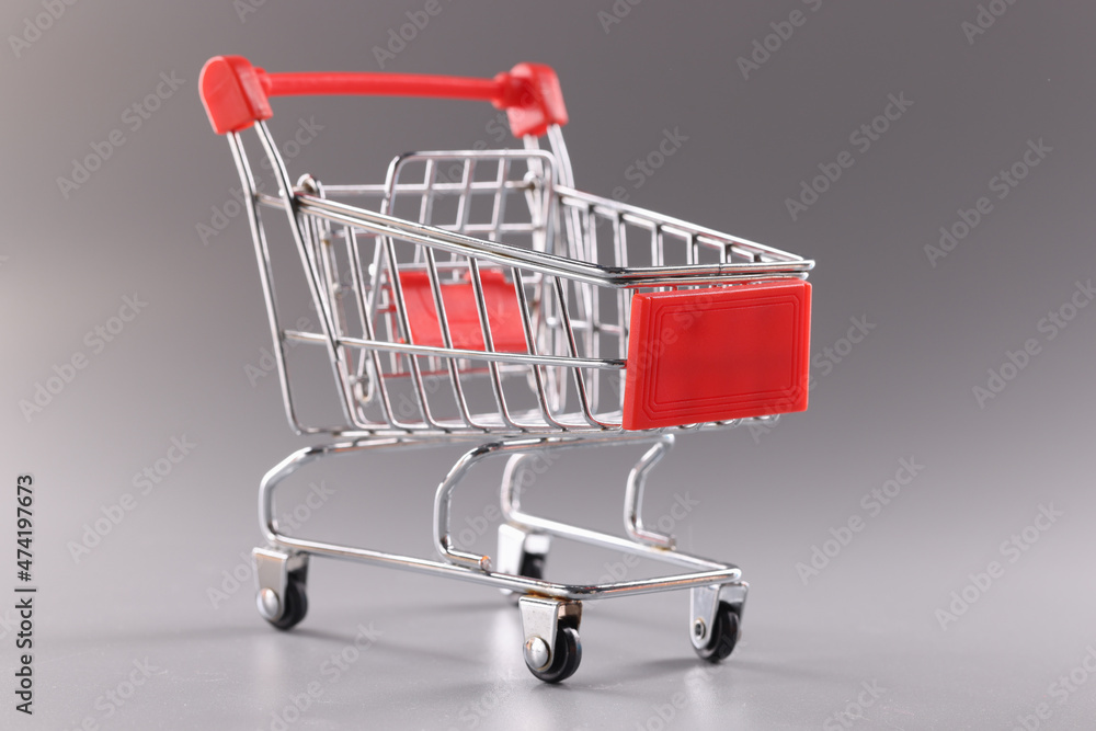 Trolley with chrome handle on gray background