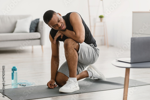 Exhausted African Guy Tired Of Online Workout Sitting At Home