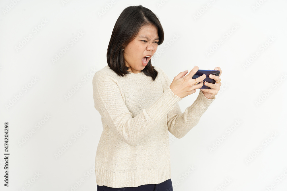 Playing Mobile Game on smartphone of Beautiful Asian Woman Isolated On White Background Playing Mobile Game on smartphone of Beautiful Asian Woman Isolated On White Background
