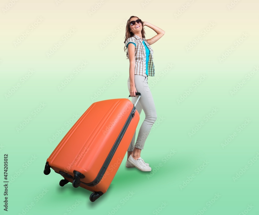 Happy traveler tourist woman in casual clothes hold suitcase. Air flight journey concept Happy traveler tourist woman in casual clothes hold suitcase. Air flight journey concept