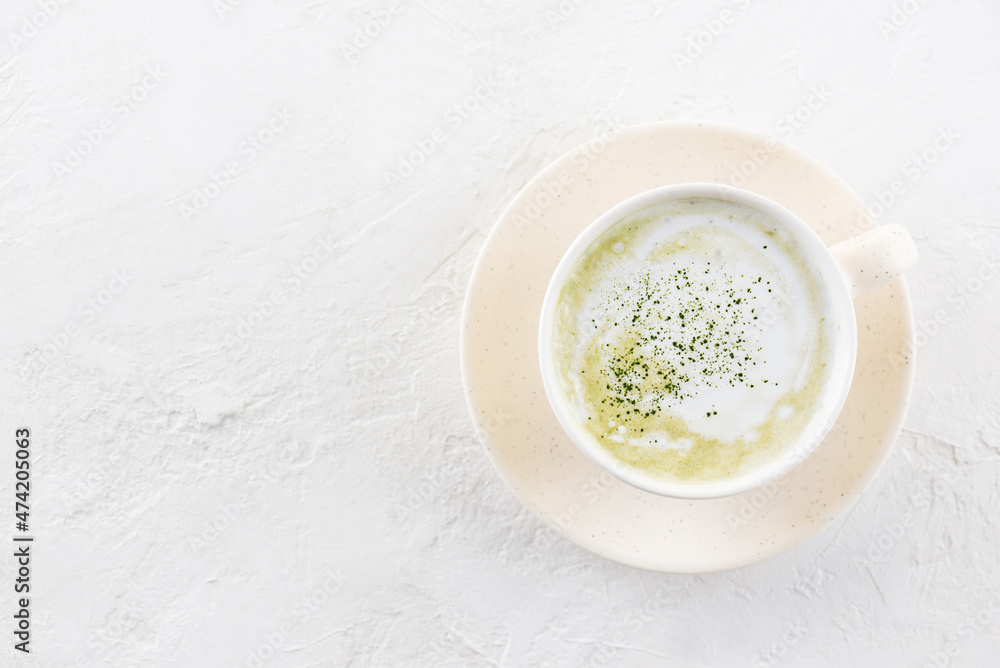 Matcha latte tea with coconut milk in a mug. Horizontal orientation, copy space, top view.